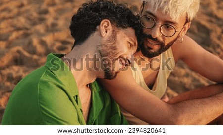 Romantic moments, homosexual couple enjoying intercourse with each other while sitting on the beach at dawn