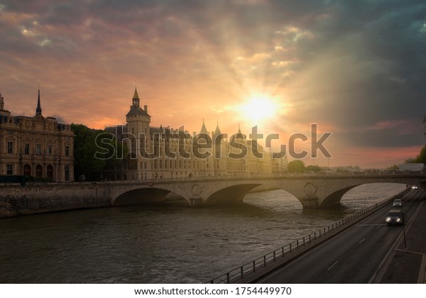 Romantic of Paris center city on the\
Seine river during the warm orange color sunset,\
France