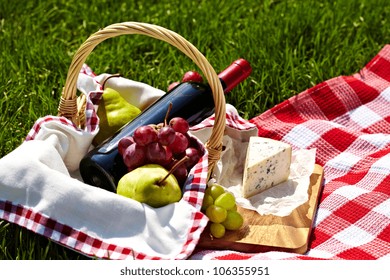 Romantic Picnic Basket With Wine, Blue Cheese, Pears And Grapes