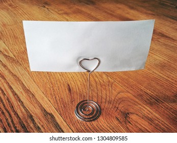 romantic place card on table, empty tag on wooden background
