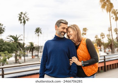 Romantic portrait of adult couple bonding with love in the city - Powered by Shutterstock