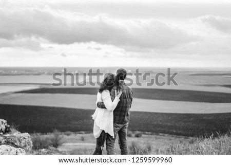 Similar – Image, Stock Photo Couple kissing on the field