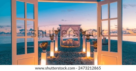 Romantic proposal sunset dinner. Candles white decoration pavilion, door close to sea sand beach. Love honeymoon anniversary dinner on tropical beach. Destination romance wedding, luxury couple travel