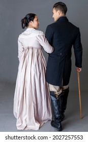 Romantic Regency couple together against a grey studio backdrop