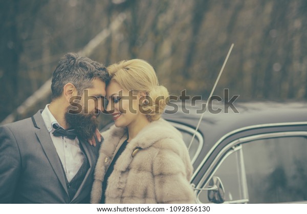 romantic relationship of sexy girl and man. romantic\
couple at retro car