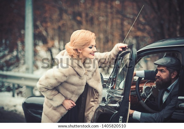 romantic relationship of sexy girl and man. romantic
couple at retro car