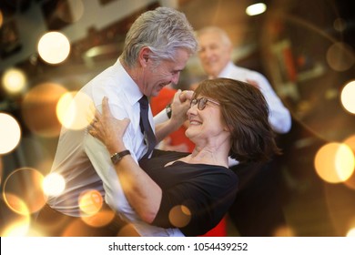 Romantic senior couple dancing together at dance hall - Powered by Shutterstock