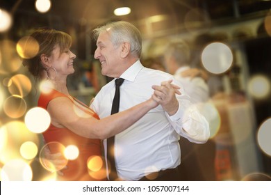 Romantic Senior Couple Dancing Together At Dance Hall