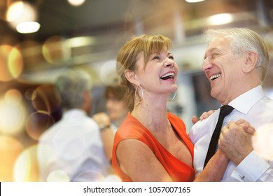 Romantic Senior Couple Dancing Together At Dance Hall