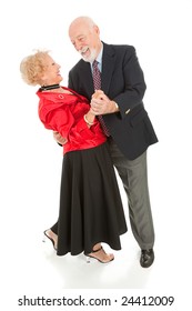 Romantic Senior Couple Dancing Together.  He's Dipping His Beautiful Wife.  Full Body Isolated.