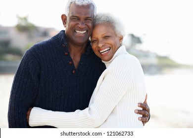 Romantic Senior Couple Hugging On Beach