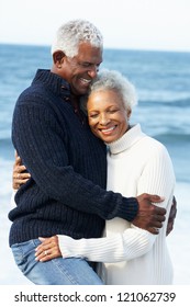 Romantic Senior Couple Hugging On Beach