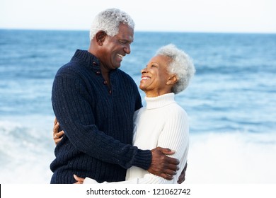 Romantic Senior Couple Hugging On Beach