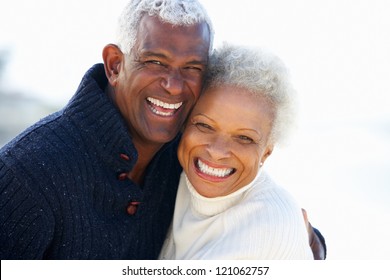 Romantic Senior Couple Hugging On Beach - Powered by Shutterstock