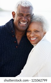 Romantic Senior Couple Hugging On Beach