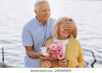 Romantic Senior Gentleman Making Proposal To Happy Excited Lady Outdoors, Grey Haired Man With Engagement Ring Proposing Marriage To Joyful Woman While They Walking In Summer Park - Powered by Shutterstock