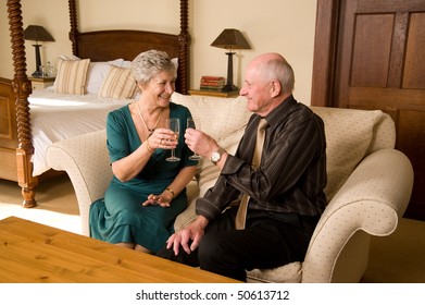 Romantic Senior Older Couple Celebrating In Beautiful Hotel Suite