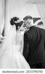 Romantic Serenade: Capturing the Timeless Elegance of a Wedding Embrace in Black and White.