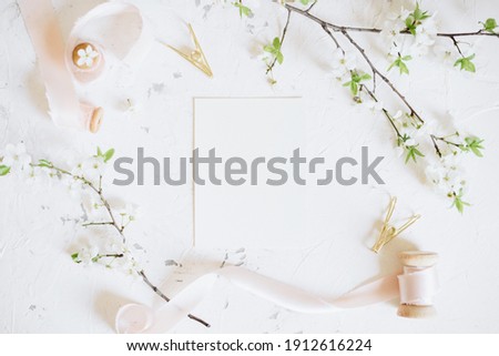 Romantic spring mock up with white card and femininne vintage pink ribbons