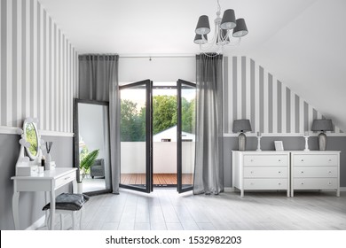Romantic style gray room with white dressing table and chest of drawers