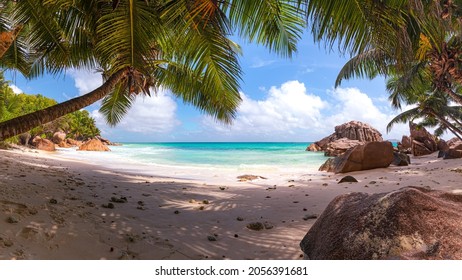 Romantic sunset at Anse Source d'Argent beach on La Digue in the Seychelles 