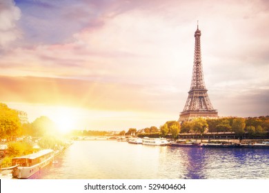 Romantic sunset background. Eiffel Tower with boats on Seine river in Paris, France. - Shutterstock ID 529404604