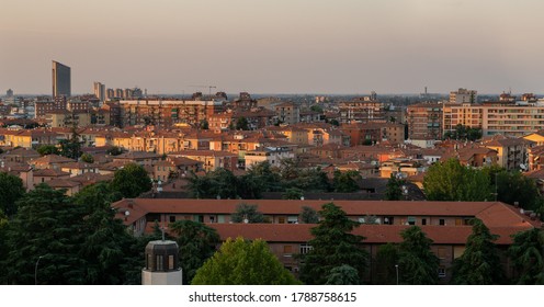 Romantic Sunset over the Bologna Cityscape. Orange warm sunset sky with amazing rooftop view of the red city. Bologna, Italy, Europe.