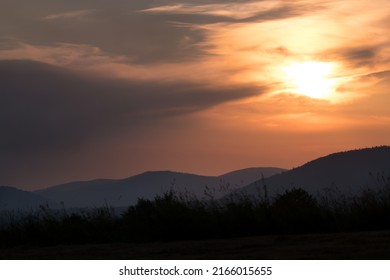 A Romantic Sunset Over The Mountains, The Polish Bieszczady Mountains, The Carpathians, The Sun's Rays Hide Behind The Mountains, A Beautiful Sunset In The Mountains, A Romantic View For Those In Love