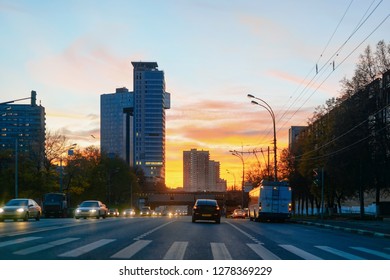 Romantic Sunset And Street View With Cars On The Road In Moscow City Center In Russia In The Morning.