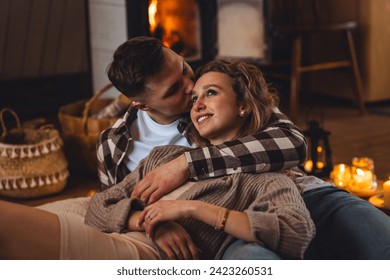 Romantic surprise for Saint Valentine's Day, christmas, new year. Weekend in the mountains in a countryside chalet house. Cozy atmosphere, relax. Candles, garlands, fireplace. Marriage proposal