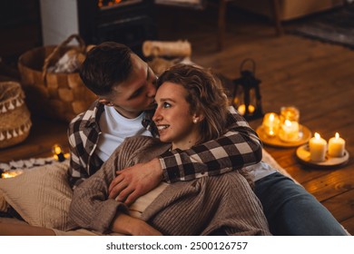 Romantic surprise for Saint Valentine's Day, christmas, new year. Weekend in the mountains in a countryside chalet house. Cozy atmosphere, relax. Candles, garlands, fireplace. Marriage proposal - Powered by Shutterstock