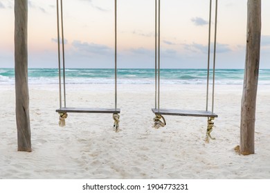 Romantic swings in Tulum Mexico watching a sunset