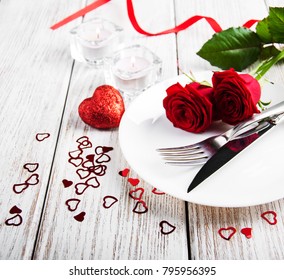 Romantic Table Setting With Red Roses And Hearts