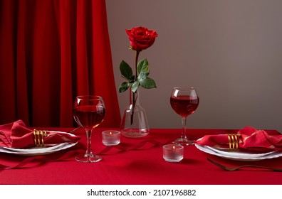 Romantic table setting with white dinnerware and red napkins, wine and candles. Valentines day or romantic dinner concept. Romantic Dinner. - Powered by Shutterstock