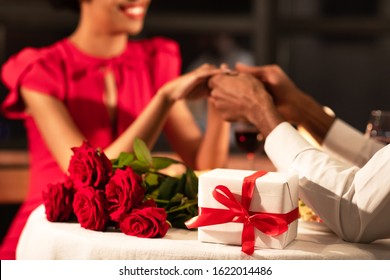 Romantic Valentine's Dinner. Unrecognizable Couple Holding Hands Having Date In Fancy Restaurant. Selective Focus, Cropped