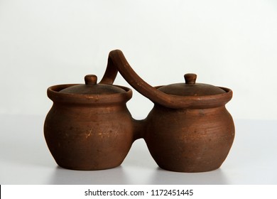 Romantic version of clay pot for two in studio against white background. 