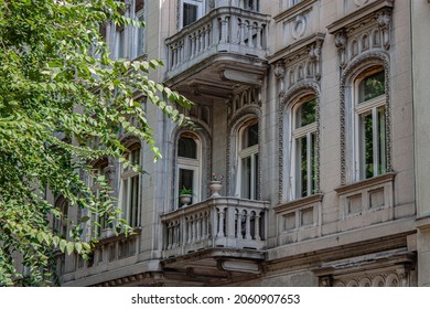 Romantic View Of A Historical City Building In The Old Town Of Budapest, Hungary, Europe Bright Summer Day, Ancient Stone Balcony And Beautiful Ornated Facade In The Oldest Part Of The V. District. 