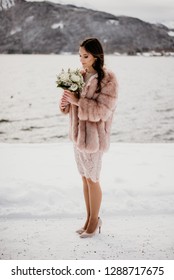 Romantic Wedding Moment, Bride Portrait, Bride Posing Near The Lake. Winter Wedding