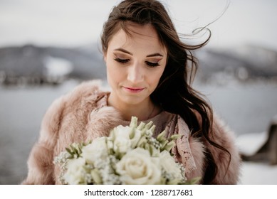 Romantic Wedding Moment, Bride Portrait, Bride Posing Near The Lake. Winter Wedding