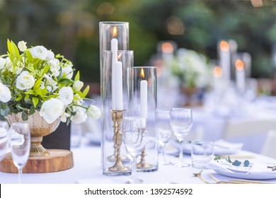 Romantic Wedding Table Top Layout Table Spread With Flowers And Candled No People With Gold Cutlery White Table Cloth And Scenic View Of Sunset And Blue Skies With Copy Space Tablescape