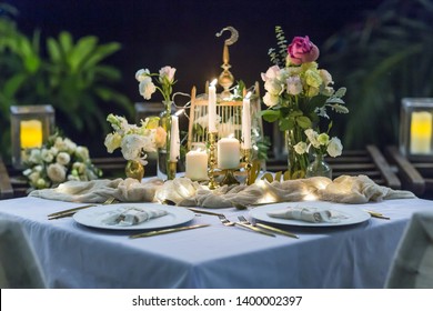 Romantic Wedding Table Top Layout Table Spread No People Tropical Location With Gold Cutlery At Night Evening Event