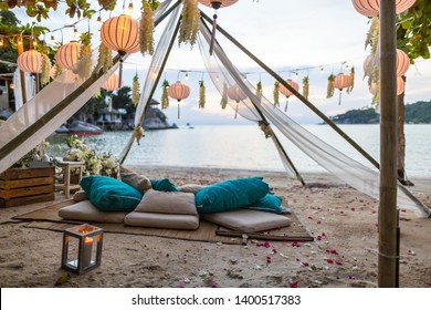 Romantic Wedding Table Top Layout Table Spread No People Tropical Location With Gold Cutlery And Scenic View Of Sunset On The Beach