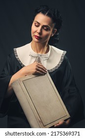 Romantic Woman Holding A Big Book