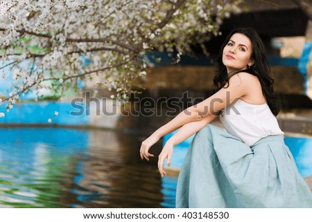 Romantic woman in a spring flourishing park