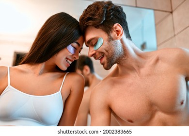 A romantic young couple in the bathroom have fun and does facials by sticking moisturizing patches under their eyes. Morning routine, facial skin care. - Powered by Shutterstock