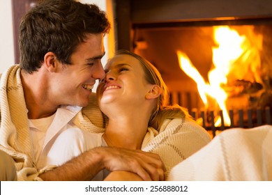 Romantic Young Couple Cuddling On Couch