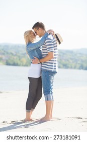 Romantic Young Couple On The Beach