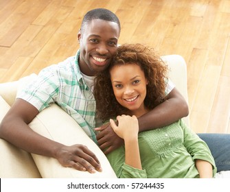 Romantic Young Couple Relaxing Sitting On Sofa