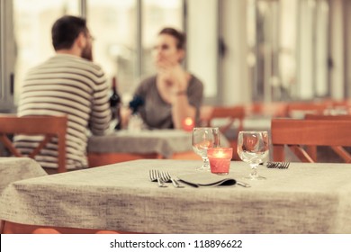 Romantic Young Couple At Restaurant