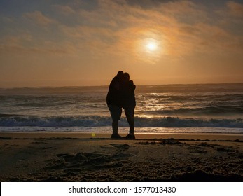 Romantics at the beach sunset.